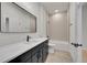 Beautiful bathroom featuring modern fixtures, neutral tiling, and a sleek vanity at 1029 9Th St, Boulder, CO 80302