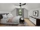 Cozy bedroom featuring a ceiling fan, a comfortable bed, and a window with natural light at 1029 9Th St, Boulder, CO 80302