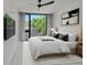 Modern bedroom featuring a large window, stylish decor, and a comfortable bed at 1029 9Th St, Boulder, CO 80302