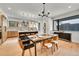 Dining room with stylish lighting, modern chairs, and a view into the well-appointed kitchen at 1029 9Th St, Boulder, CO 80302