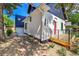 Side view of home with white brick, black trim, and a modern addition at 1029 9Th St, Boulder, CO 80302