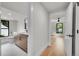 Hallway view towards a bathroom with a modern vanity and a well-lit bedroom at 1029 9Th St, Boulder, CO 80302