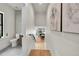 Hallway with a glimpse into a powder room and an adjacent dining room area at 1029 9Th St, Boulder, CO 80302