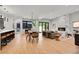 Open-concept living space with dining area, modern fireplace, and light hardwood floors at 1029 9Th St, Boulder, CO 80302