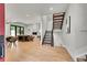 Open-concept living space with hardwood floors, fireplace, and modern staircase at 1029 9Th St, Boulder, CO 80302