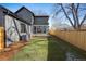 View of backyard, detached garage, and fence at 1149 S Madison St, Denver, CO 80210