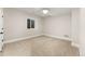 Finished basement room with carpeted floor and window at 1149 S Madison St, Denver, CO 80210