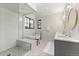 Luxurious bathroom with a walk-in shower, soaking tub, and double vanity sinks at 1149 S Madison St, Denver, CO 80210