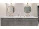 Elegant double vanity featuring modern fixtures, decorative mirrors and lots of storage at 1149 S Madison St, Denver, CO 80210