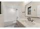 Full bath with white subway tile, new vanity and fixtures at 1149 S Madison St, Denver, CO 80210