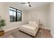 Bright bedroom with large window and neutral decor at 1149 S Madison St, Denver, CO 80210