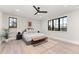 Spacious bedroom with wood floors and large windows at 1149 S Madison St, Denver, CO 80210