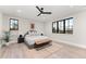 Spacious main bedroom featuring hardwood floors, neutral paint and plenty of natural light at 1149 S Madison St, Denver, CO 80210