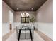 Inviting dining room featuring an eye-catching chandelier and wainscoting wall trim at 1149 S Madison St, Denver, CO 80210