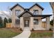 Stunning new construction featuring brick facade and covered porch on professionally landscaped lot at 1149 S Madison St, Denver, CO 80210