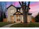 Two-story brick house at dusk at 1149 S Madison St, Denver, CO 80210