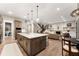 Open concept kitchen with large island and breakfast bar at 1149 S Madison St, Denver, CO 80210