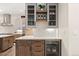 Kitchen wet bar with wine storage and beverage cooler at 1149 S Madison St, Denver, CO 80210