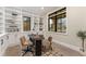 Charming office space with built-in shelving and ample natural light from multiple windows at 1149 S Madison St, Denver, CO 80210