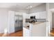 Bright kitchen with granite countertops, stainless steel appliances, and ample storage space at 3857 Mossy Rock Dr # 201, Highlands Ranch, CO 80126