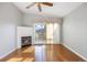 Cozy living room features a fireplace, ceiling fan, and sliding door access to the deck at 3857 Mossy Rock Dr # 201, Highlands Ranch, CO 80126