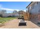 The backyard includes a fire pit area, a wooden staircase, and a brick exterior at 11506 Fowler Dr, Northglenn, CO 80233