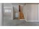 Finished basement with carpeting, staircase, and access to the main level at 11506 Fowler Dr, Northglenn, CO 80233