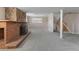 Spacious basement featuring a stone fireplace, neutral carpet and stairs to the upper level at 11506 Fowler Dr, Northglenn, CO 80233