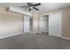 The bedroom features neutral carpet, two closets with doors, and access to additional rooms at 11506 Fowler Dr, Northglenn, CO 80233