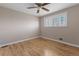 Bright bedroom features hardwood floors, neutral walls and shuttered window at 11506 Fowler Dr, Northglenn, CO 80233