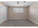 Cozy bedroom featuring neutral carpet, a ceiling fan, and a window with plantation shutters at 11506 Fowler Dr, Northglenn, CO 80233