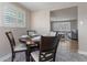 Charming dining area with seating for four adjacent to living room at 11506 Fowler Dr, Northglenn, CO 80233