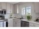 Updated kitchen with stainless appliances, ample counter space, and bright lighting at 11506 Fowler Dr, Northglenn, CO 80233