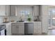 Bright kitchen with white cabinets, stainless appliances, and subway tile backsplash at 11506 Fowler Dr, Northglenn, CO 80233