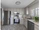 Modern kitchen features stainless appliances, subway tile backsplash and patterned flooring at 11506 Fowler Dr, Northglenn, CO 80233