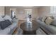 Comfortable living room featuring hardwood floors, and views of the dining area at 11506 Fowler Dr, Northglenn, CO 80233