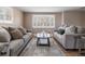 Inviting living room with neutral walls, hardwood floors, and cozy seating arrangement with couches at 11506 Fowler Dr, Northglenn, CO 80233