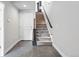 Inviting entryway with slate flooring, stairs, a coat closet, and a neutral color palette at 815 Promenade Dr, Superior, CO 80027