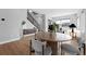 Bright living room with hardwood floors, modern furnishings, and staircase at 815 Promenade Dr, Superior, CO 80027