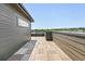 Rooftop deck featuring wood-look tiling, siding, and a partial view of the neighborhood at 815 Promenade Dr, Superior, CO 80027