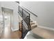 Stylish staircase featuring carpeted steps and modern black metal railing at 815 Promenade Dr, Superior, CO 80027