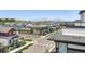 Street view in a residential neighborhood with green homes and mountain views at 815 Promenade Dr, Superior, CO 80027