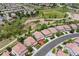 Aerial view of a neighborhood showcasing houses nestled beside open green spaces and walking trails at 2307 Candleglow St, Castle Rock, CO 80109