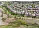 Panoramic aerial view of a residential neighborhood with well-spaced houses, green spaces, and walking paths in a suburban setting at 2307 Candleglow St, Castle Rock, CO 80109