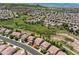 Expansive aerial shot of a residential area near green spaces and distant mountain views at 2307 Candleglow St, Castle Rock, CO 80109