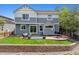 Well-maintained backyard with patio area, retaining wall, and lush green lawn at 2307 Candleglow St, Castle Rock, CO 80109