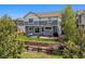 Spacious backyard featuring a patio, terraced landscaping, and a privacy fence, perfect for outdoor entertaining and relaxation at 2307 Candleglow St, Castle Rock, CO 80109