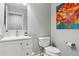 Bright bathroom featuring a modern vanity, stylish fixtures, and vibrant floral wall art at 2307 Candleglow St, Castle Rock, CO 80109