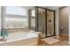 Spa-like bathroom showcasing a soaking tub and separate glass-enclosed shower at 2307 Candleglow St, Castle Rock, CO 80109