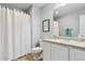 Cozy bathroom with neutral walls and tile floors featuring a shower, toilet, and vanity with a mirror at 2307 Candleglow St, Castle Rock, CO 80109